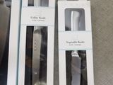 packaging of three wii remotes sitting on a table next to each other