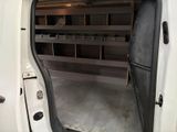 a white van with open doors and shelves in the back of it