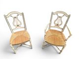 pair of antique chairs with harp backrests on white background