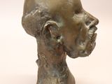 sculpture of a head of a man on a white background