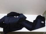 a pair of pants and a jacket sitting on a table