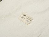 a close up of a white t shirt with a label on it