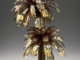 a sculpture of a palm tree made out of coins