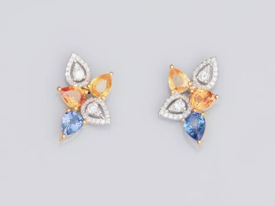 a pair of sapphire and diamond earrings
