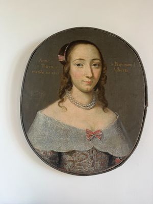 portrait of a woman in a gray dress with a red bow