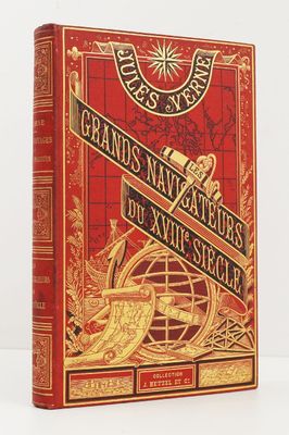 un livre rouge et doré avec un compas sur la couverture