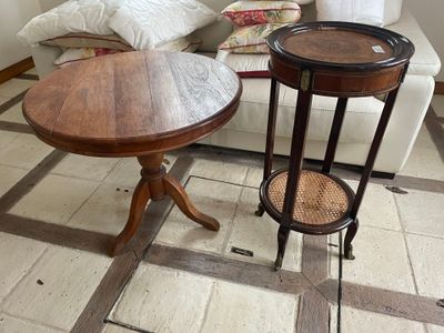 two tables that are sitting on the floor in the living room