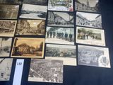 a lot of old photos on display on a table
