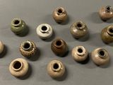 many different types of vases sitting on a table