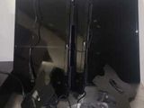 a picture of a desk with a lot of electronics on top of it