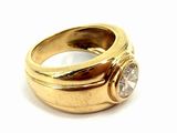 an image of a gold ring with a diamond on top of it
