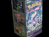 a box of pokemon cards on display on a black background