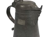 a black coffee pot with a lid on a white surface