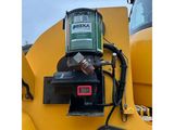 a machine that is sitting on the back of a truck