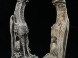 pair of stone sculptures of a giraffe and a lion