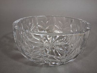 a glass bowl that is sitting on a table