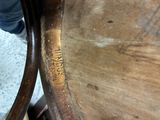 a close up view of a wooden table with writing on it