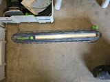a picture of a green and white vacuum and a box of tools