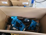 a cardboard box filled with many different types of electronics