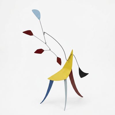an abstract sculpture of a man with a banana on his back