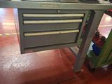 an image of a workbench in a factory with a lot of tools on it