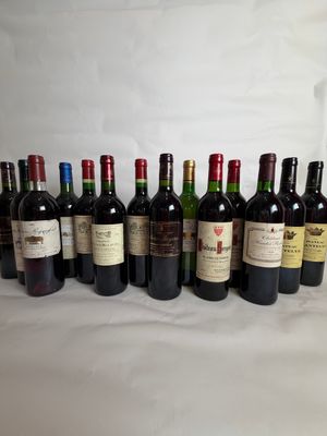 several bottles of wine are lined up on a table