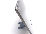a close up view of a tablet computer on a stand