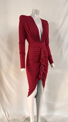 the mannequin is wearing a red dress with long sleeves