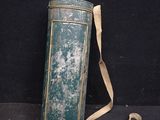 a green tin can with a strap around it
