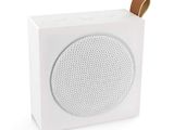 a close up of a white speaker on a white surface