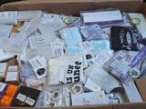 a cardboard box filled with many different types of electronic devices