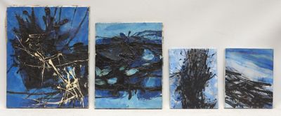 four pieces of art are hanging on a wall in a room