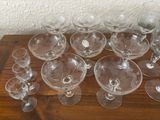 a lot of empty wine glasses sitting on a table