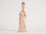 an old figurine of a woman holding a baby in her arms