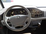 a steering wheel and dashboard of a car in a car showroom