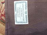 a label on a piece of fabric that is on a bed