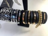 a display of bracelets and rings on a table