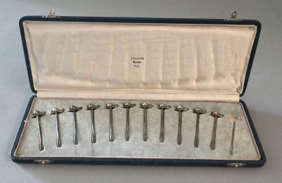 a case with six different tools in it on a table