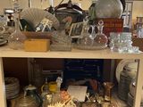 a shelf full of glass items in a store