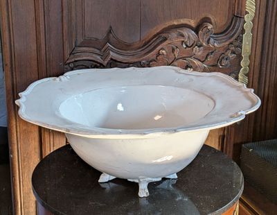 a large white bowl sitting on top of a table
