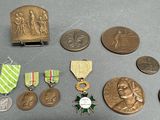 many medals and medals that are on the table