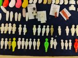 a lot of small plastic figurines on the table