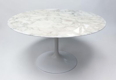 an image of a white marble table with a circular base
