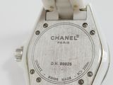 an image of a close up of a watch on a white surface
