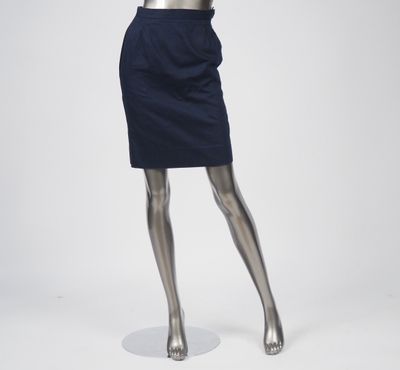 a mannequin wearing a blue dress with a gold belt