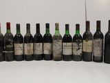 several bottles of wine are lined up in a row on a table