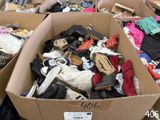 many boxes of shoes that are sitting in a store