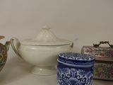 many different types of pottery on display on the table