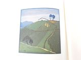 a picture of an open book with a picture of a mountain