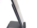 a cell phone that is sitting on top of a stand
